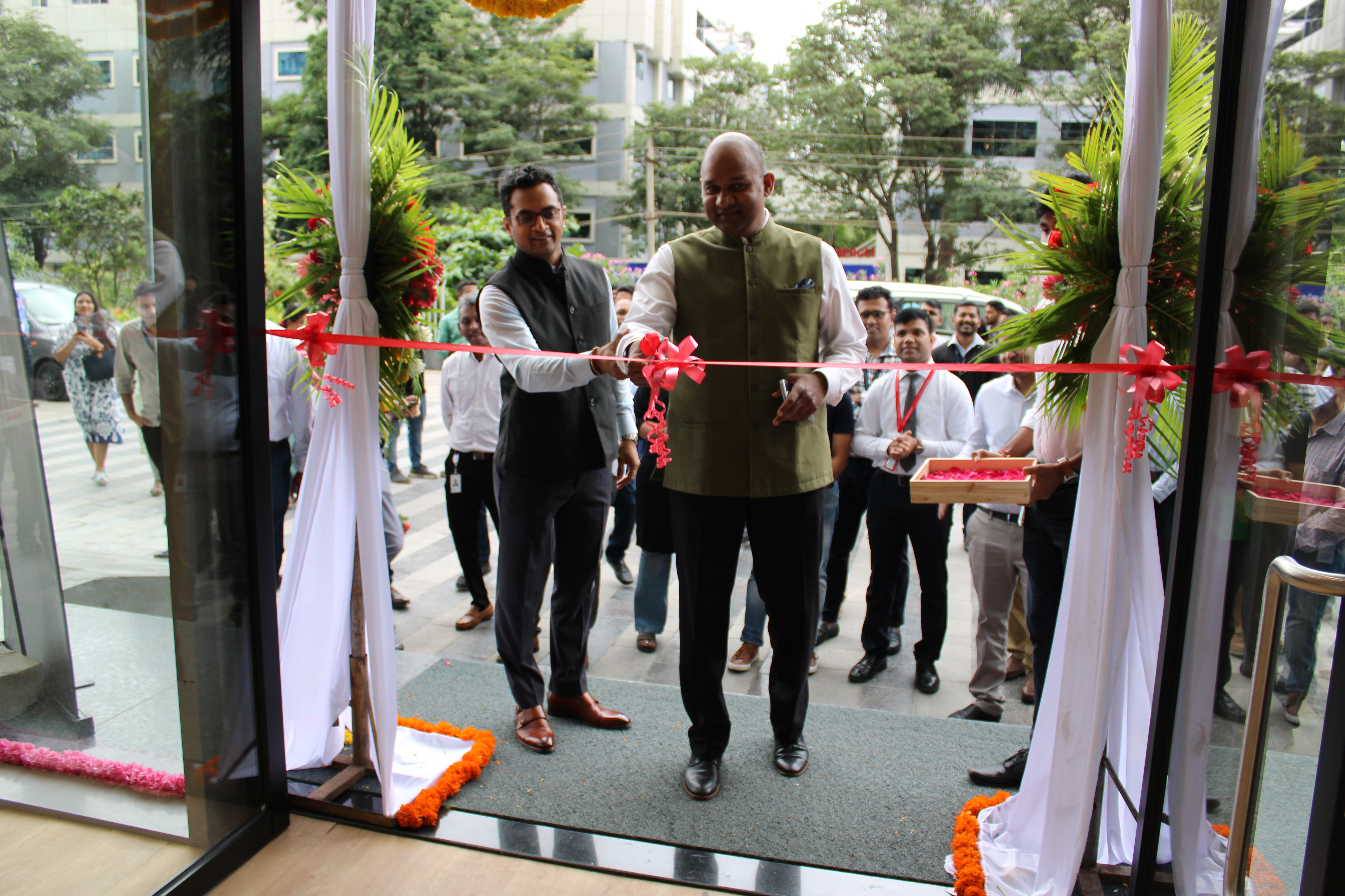 Man cutting a ribbon