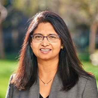 a woman in a grey suit