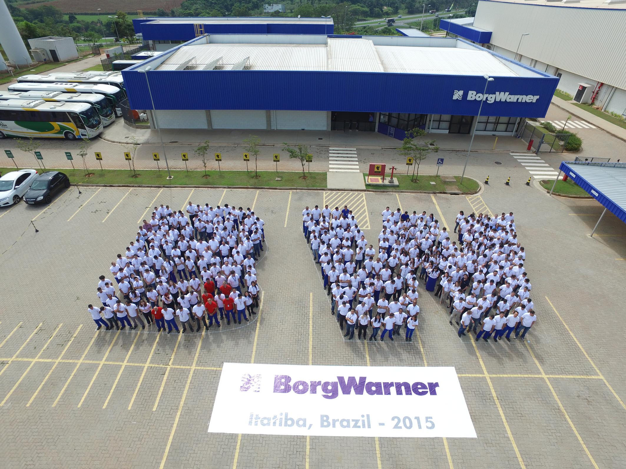 Employees forming the letters BW