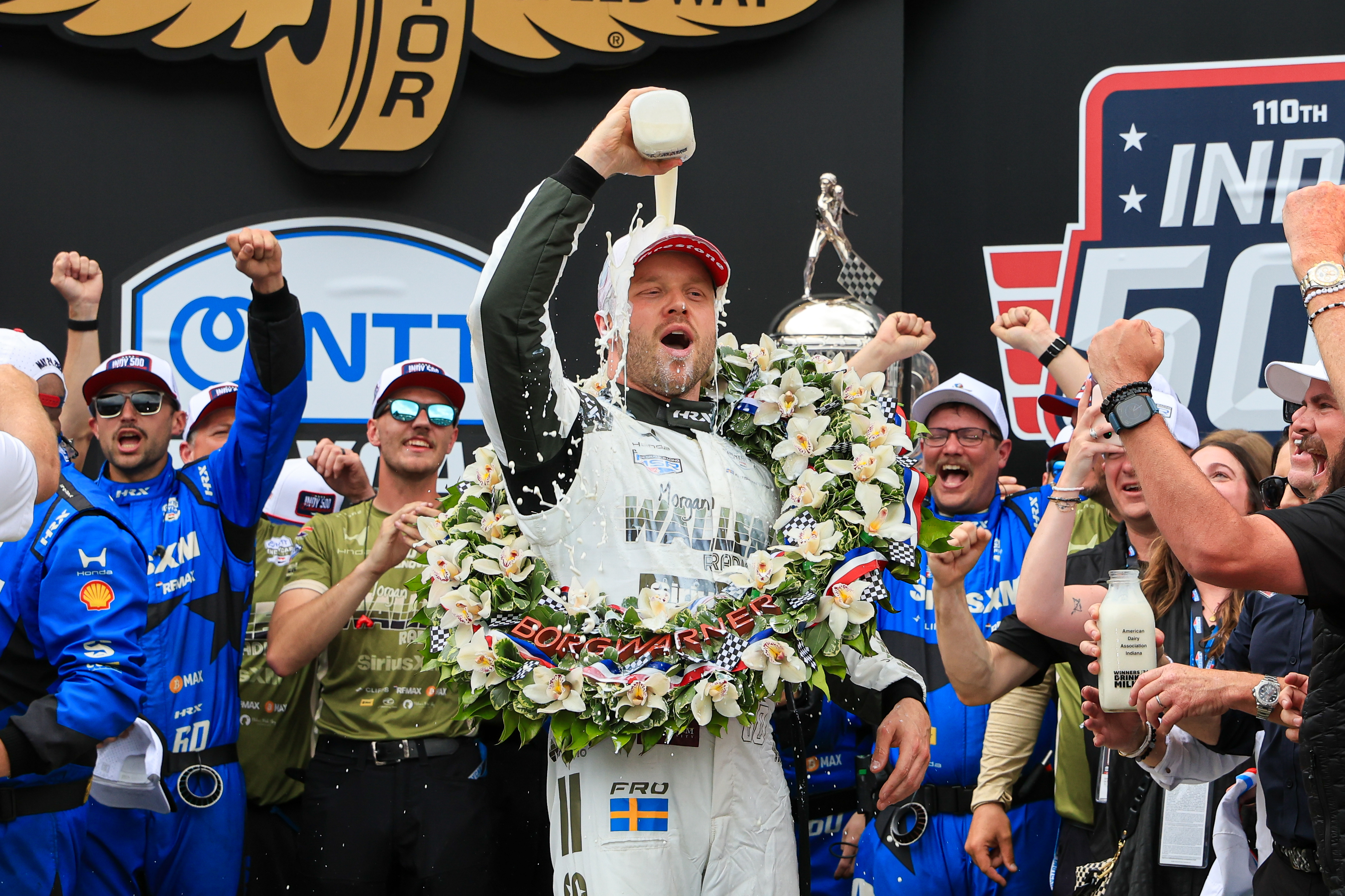 Felix Rosenqvist celebrates in Victory Circle with milk