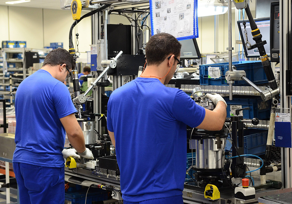 a group of men working in a factory