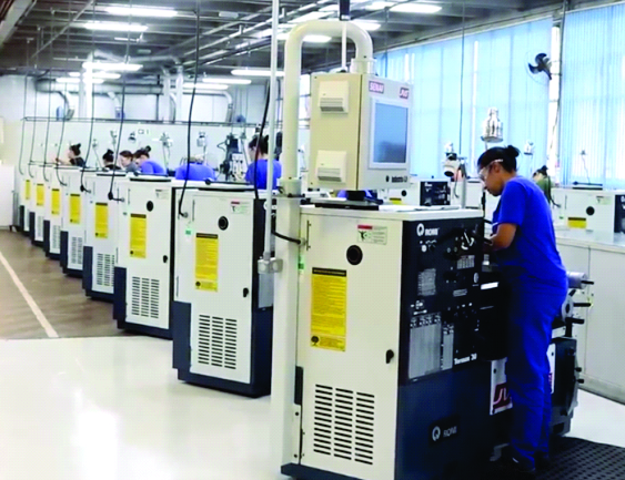 a group of people working in a factory