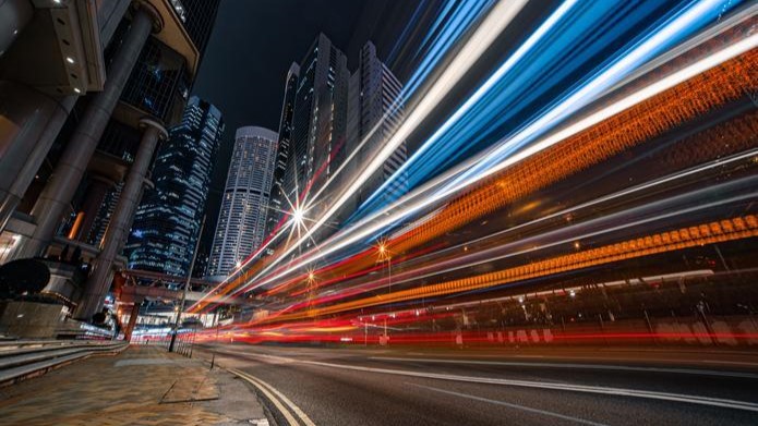 Cityscape at night with large horizontal bright lights