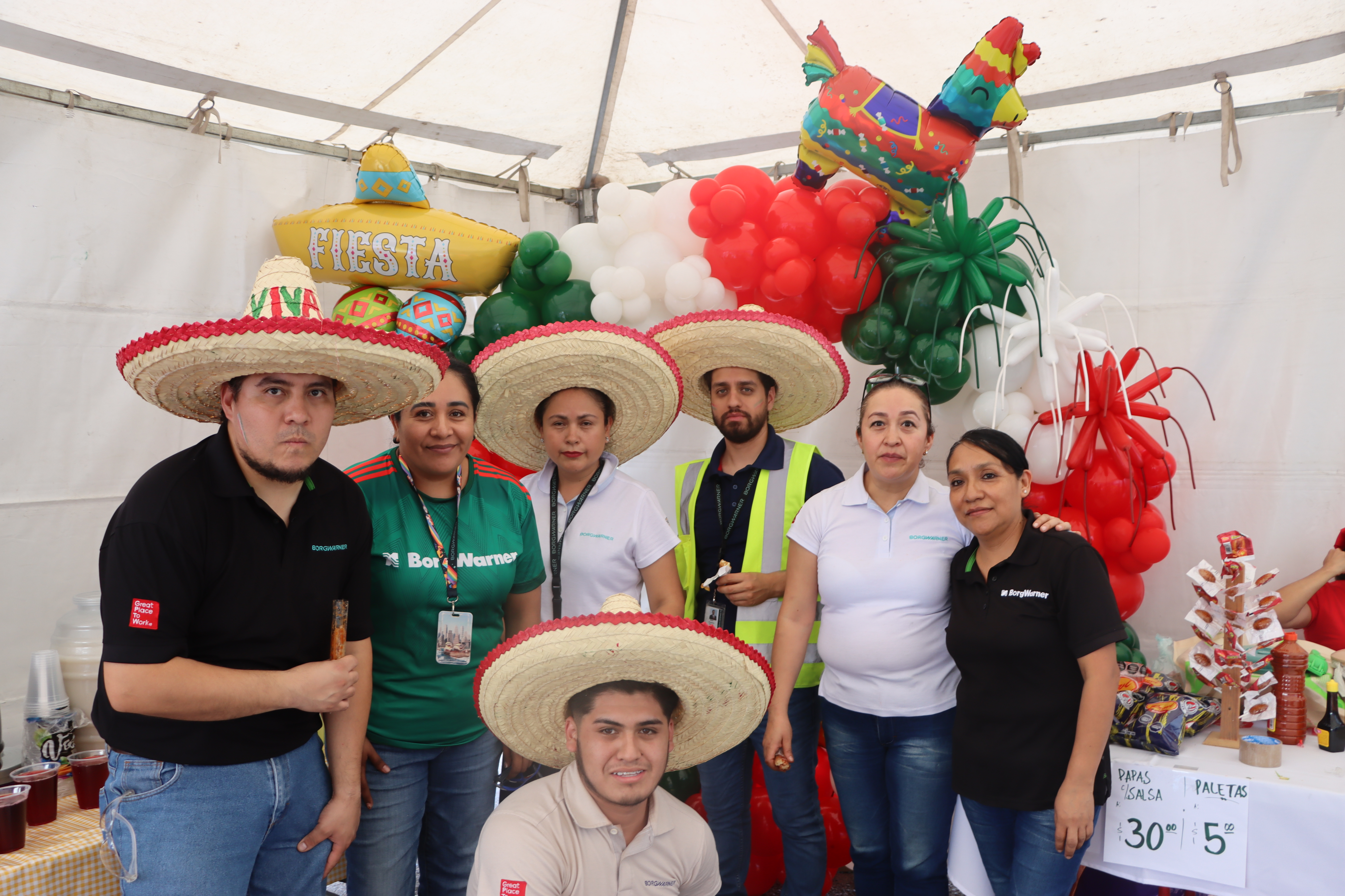 Group of people, some wearing sombreros