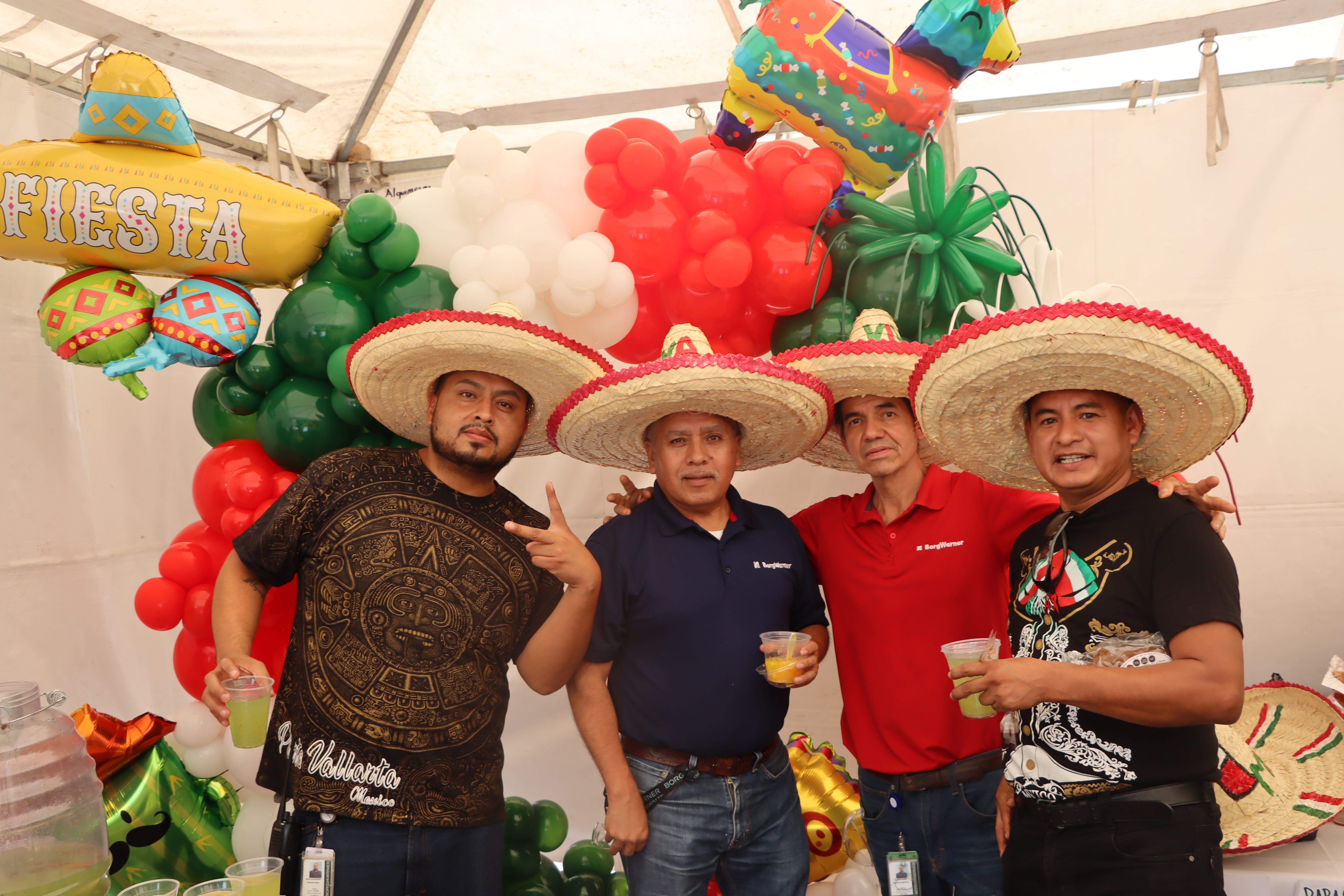 Four men wearing sombreros