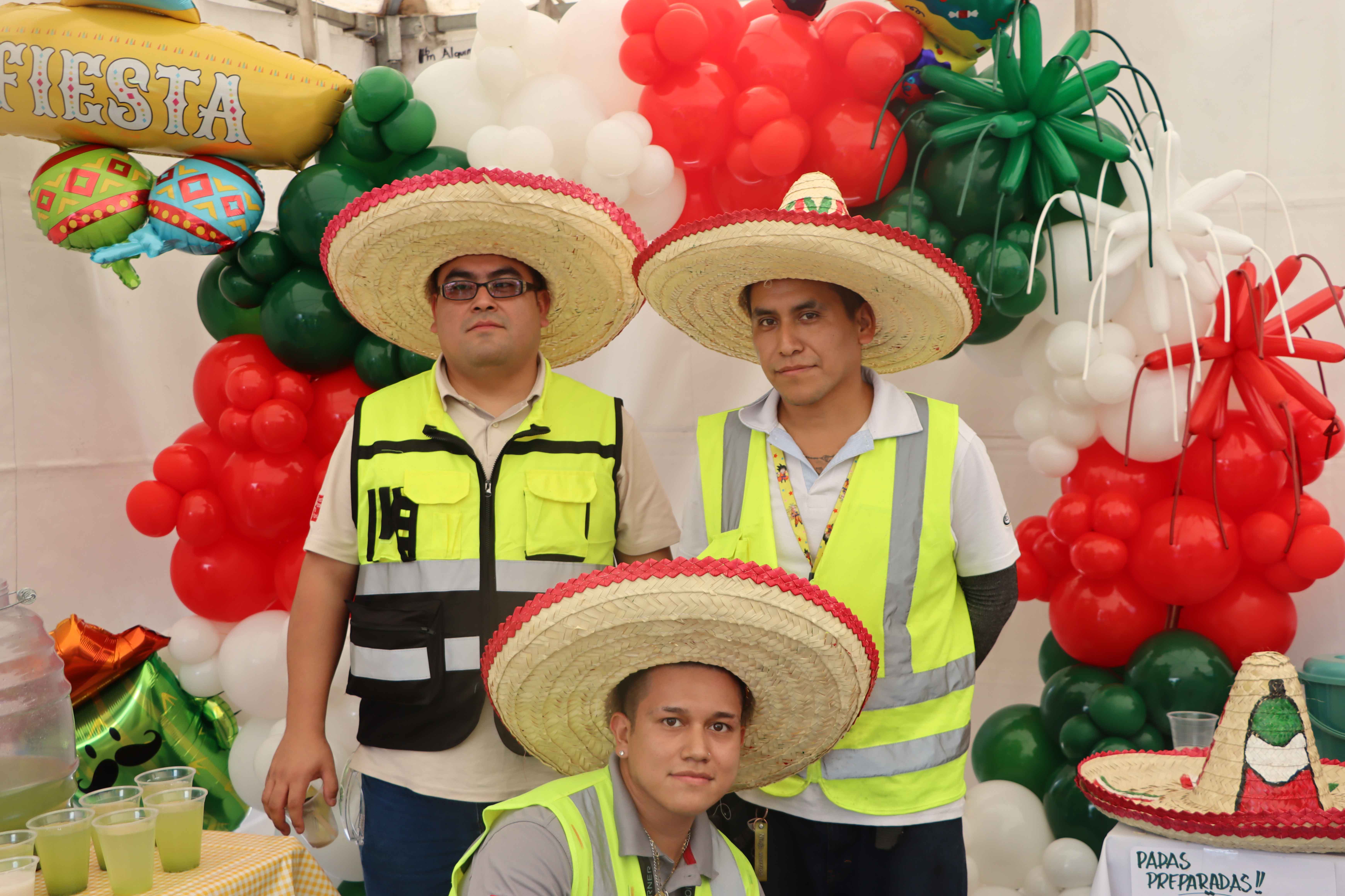 Three men wearing sombreros