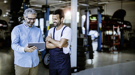 2 men in a garage