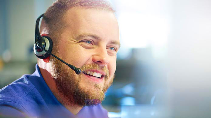 a man with a headset answering calls