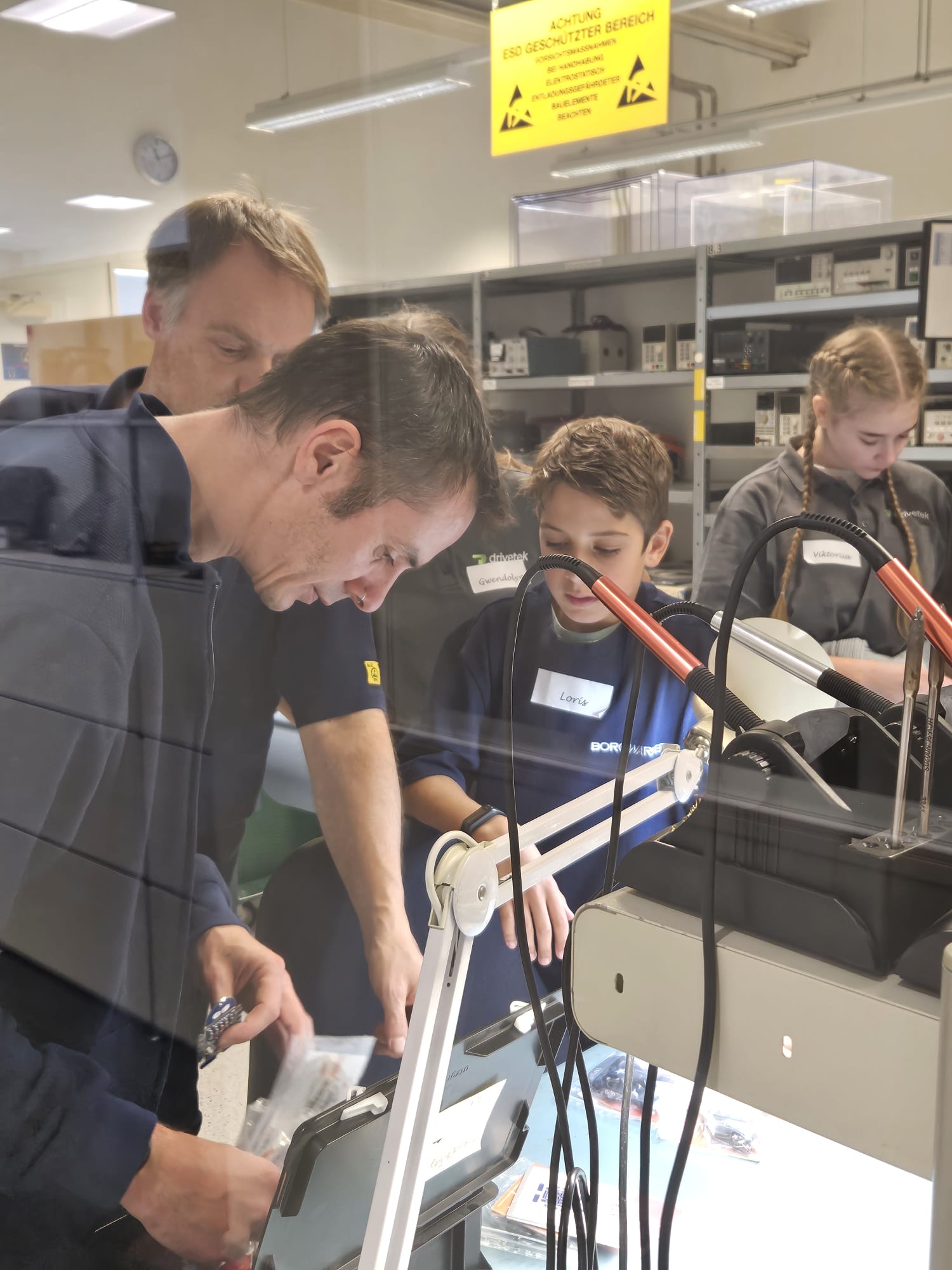 People working on electronics