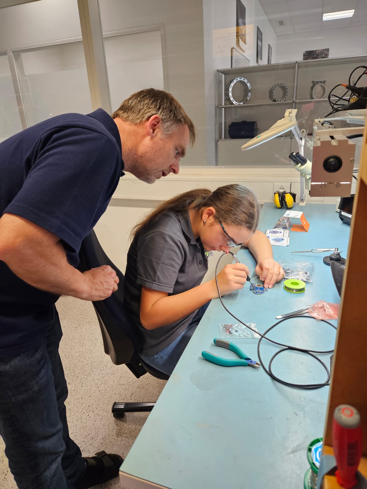 People working on electronics